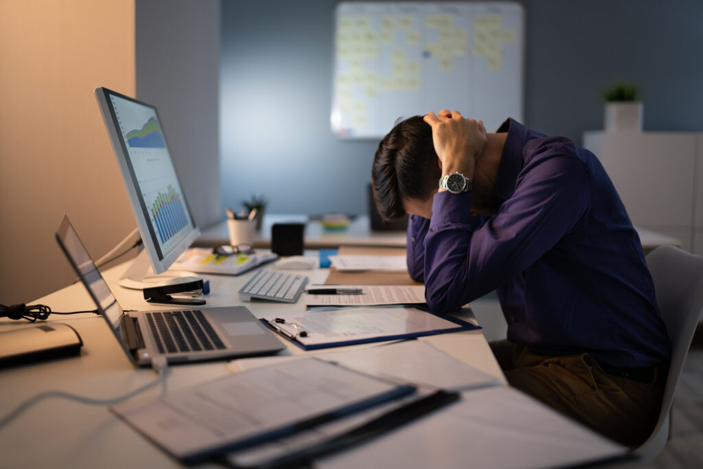 stressed accountant working late in office